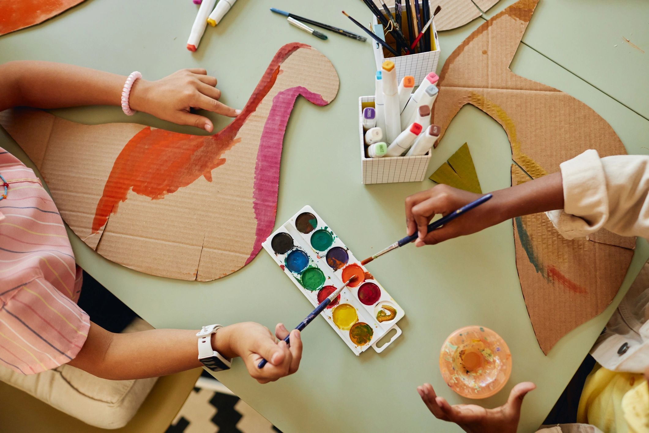 Children painting together during an art activity
